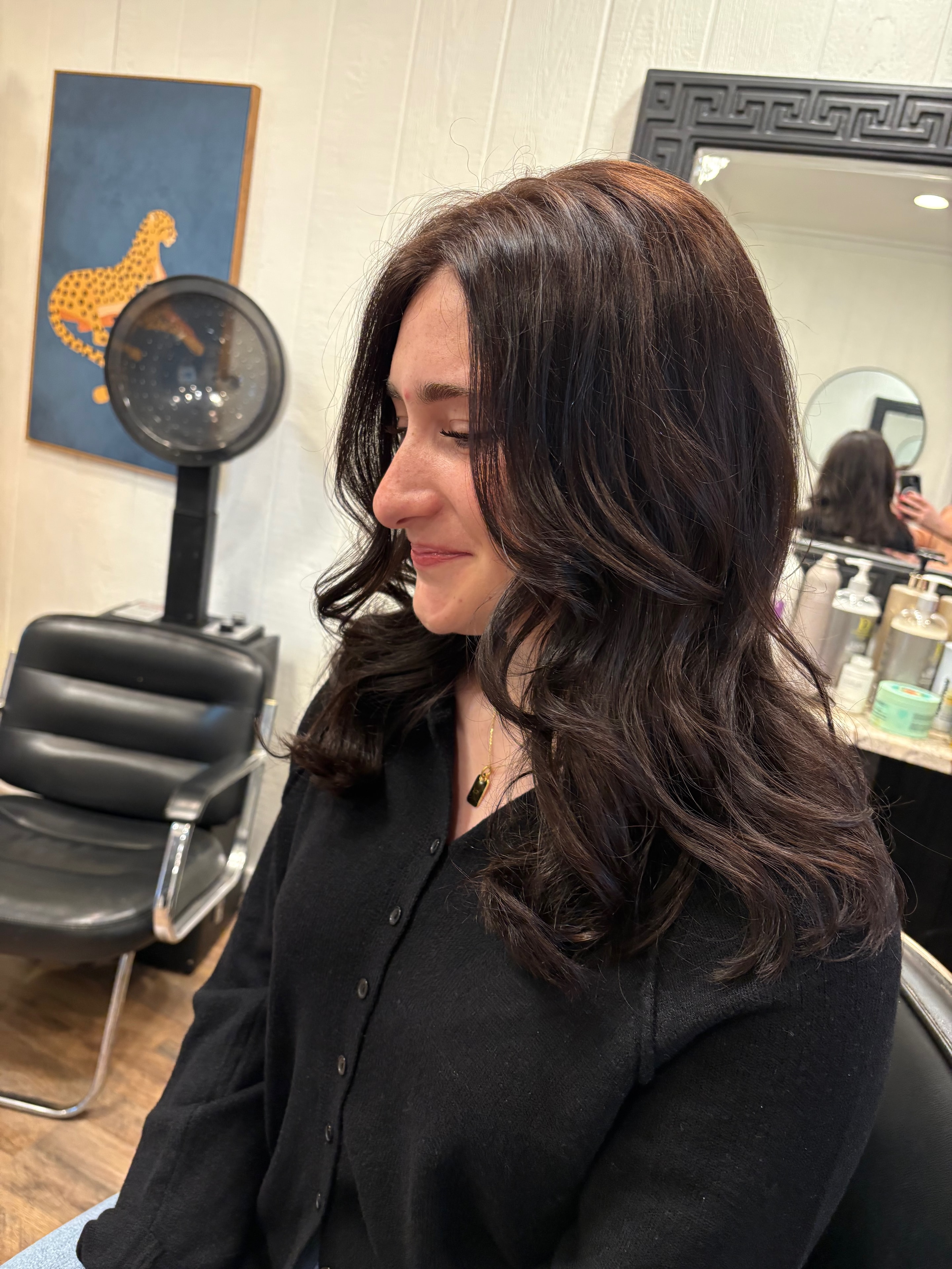 Rich dark curls styled at Salon Misty